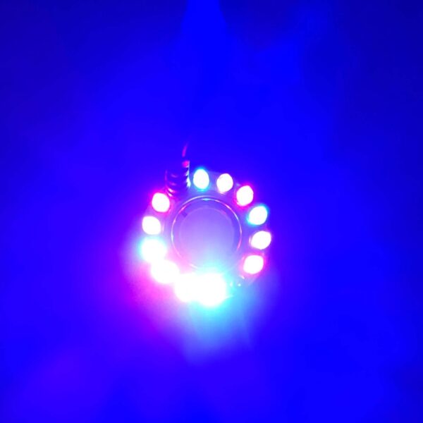Circular arrangement of bright multicolored LED lights glowing against a dark blue background